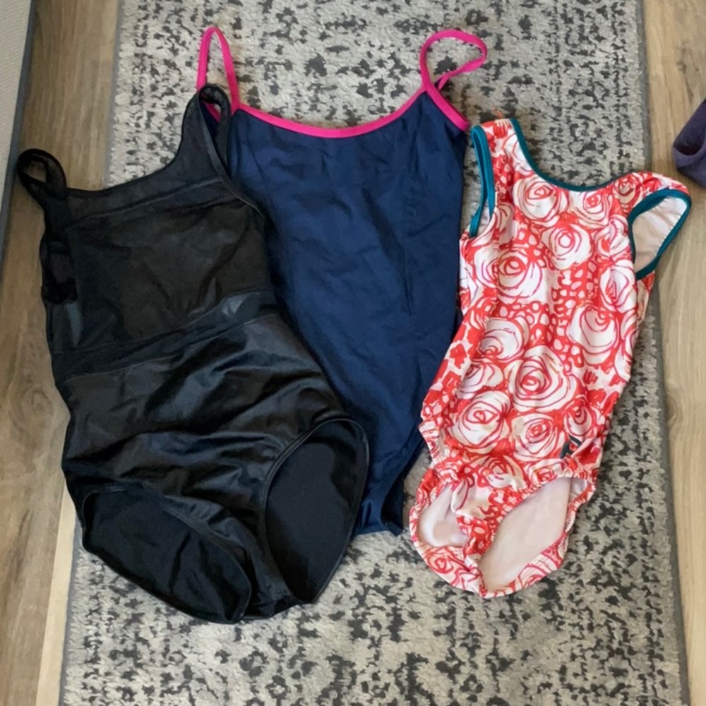 Three gymnastics/dance leotards